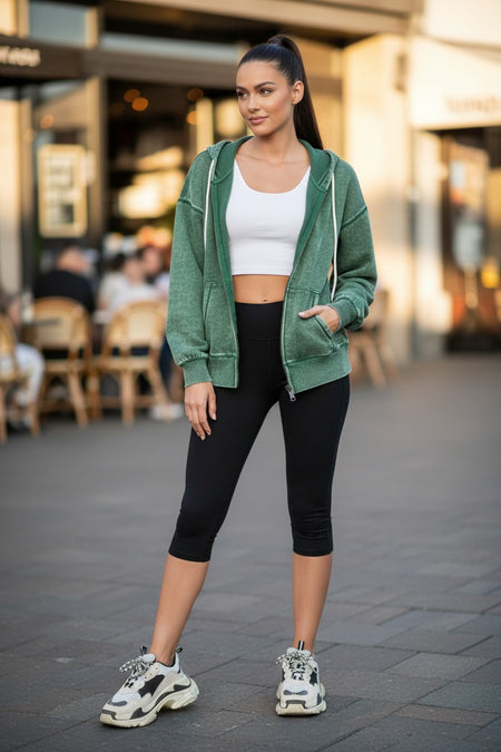 Hush Boutique acid washed green fleece zip-up hoodie jacket with drawstring hood and pockets. Cotton-polyester blend.