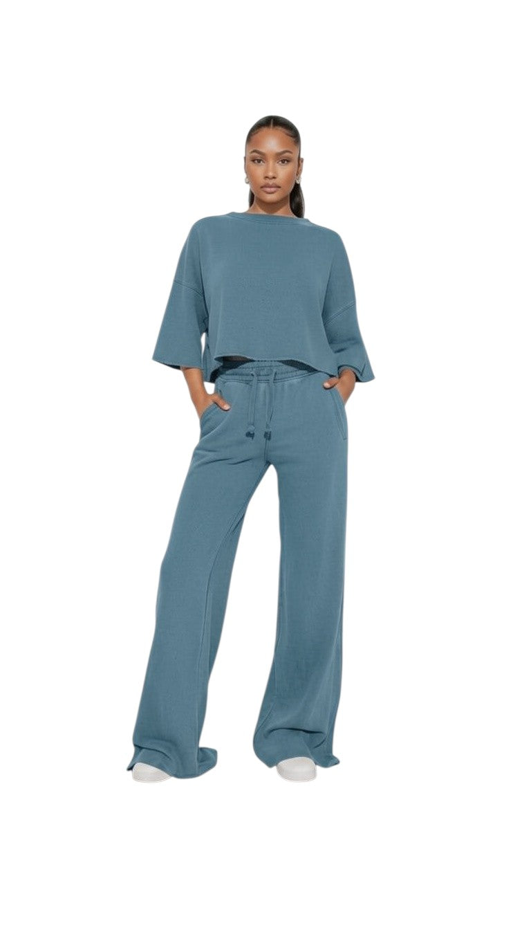 Hush Boutique vintage garment dyed two-piece set in blue with a cropped top and wide-leg elastic waist pants.