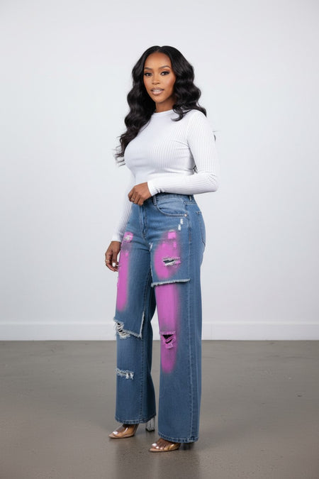 Hush Boutique Camellia Painted Double Waisted Jeans with distressed details and pink spray paint accents.