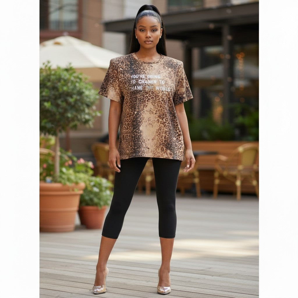 Hush Boutique cheetah print boxy t-shirt with "You're going to change the world" graphic.