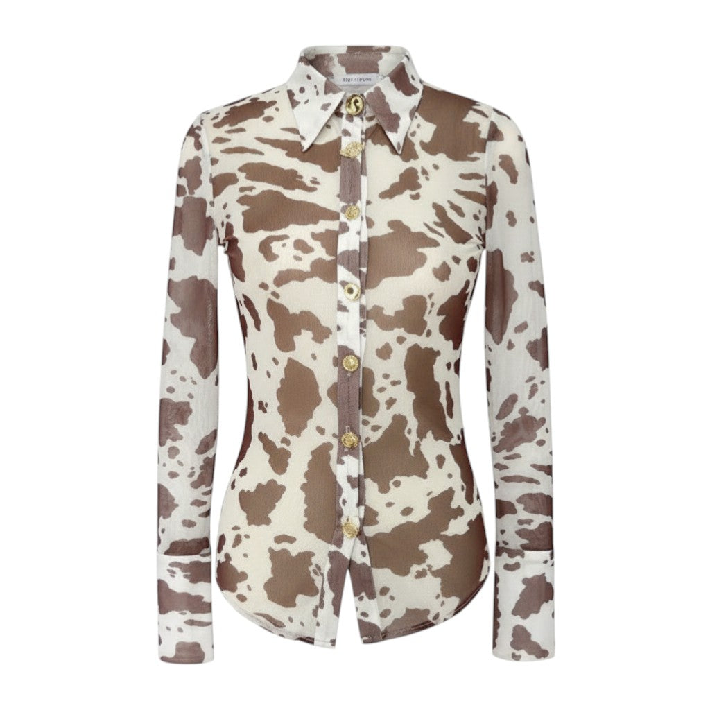 Hush Boutique cow print mesh button-up shirt with gold buttons and structured cuffs. Semi-sheer polyester.