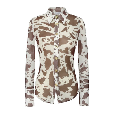 Hush Boutique cow print mesh button-up shirt with gold buttons and structured cuffs. Semi-sheer polyester.