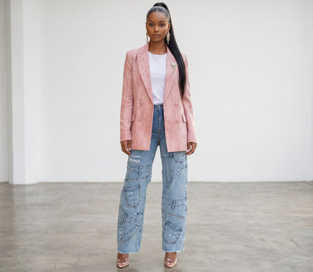 Hush Boutique Pockets Galore denim cargo jeans with invisible pockets worn by a model in a pink blazer