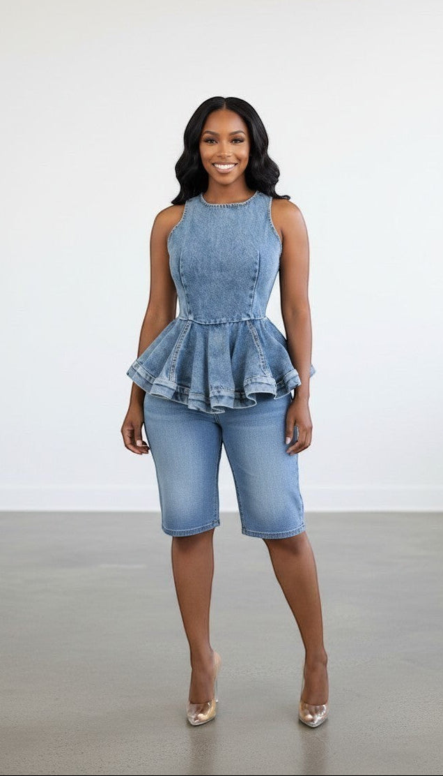 Hush Boutique sleeveless washed denim peplum top with zipper back and flared hem.
