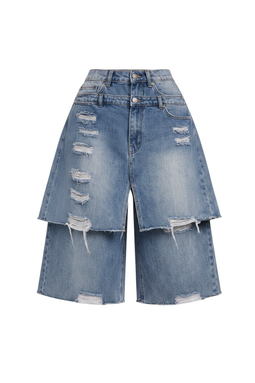 Hush Boutique double layer distressed denim Bermuda shorts in a washed blue finish with raw hem details.