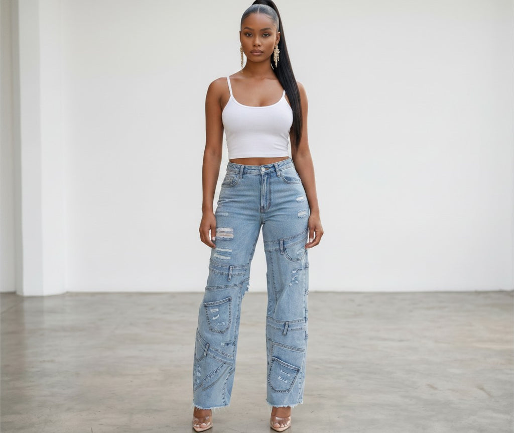 Model wearing Hush Boutique light wash denim cargo jeans with distressed details and invisible pockets