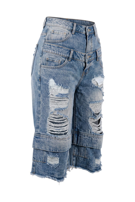Hush Boutique vintage blue denim jorts with a double-waisted design and heavy distressing on the legs.
