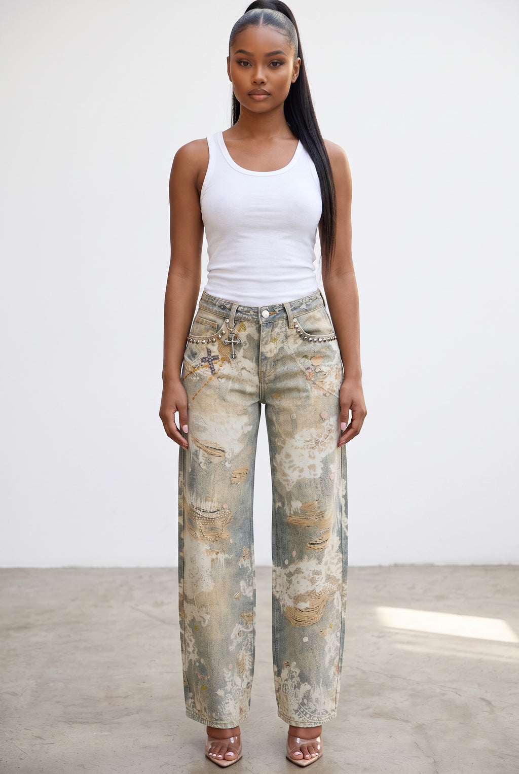 Model wearing Hush Boutique Enchanted Garden wide-leg jeans with floral print, distressing, and jewel embellishments.