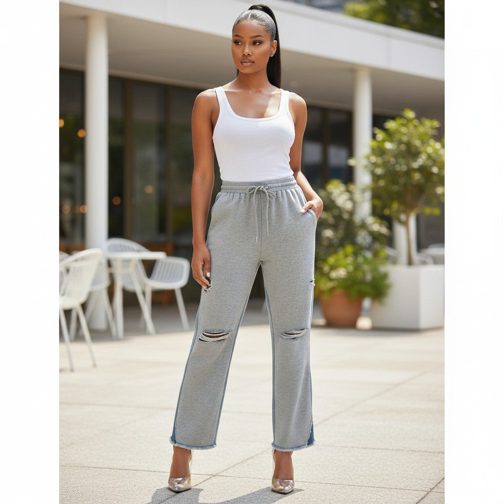 Hush Boutique grey sweatpants with denim back, drawstring waist, and ripped details.