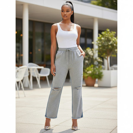 Hush Boutique grey sweatpants with denim back, drawstring waist, and ripped details.