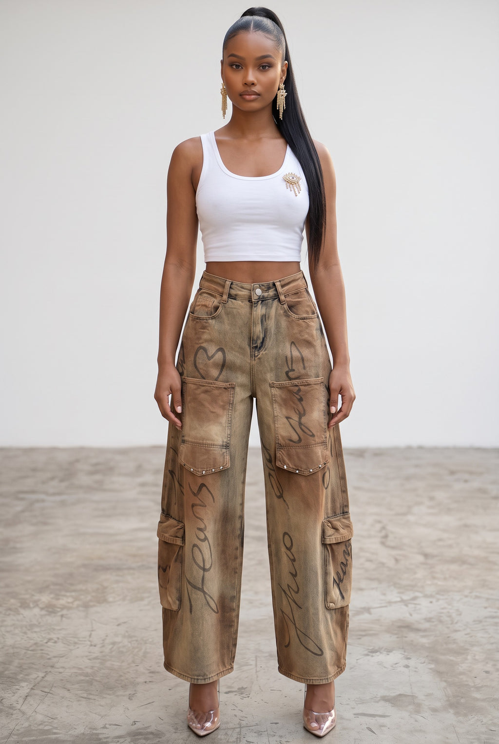 Hush Boutique barrel jeans in distressed brown denim with black heart graffiti print and utility cargo pockets