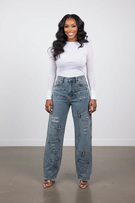 Hush Boutique Lotus blue denim jeans with multiple pockets and distressed details. 98% Cotton, 2% Spandex.