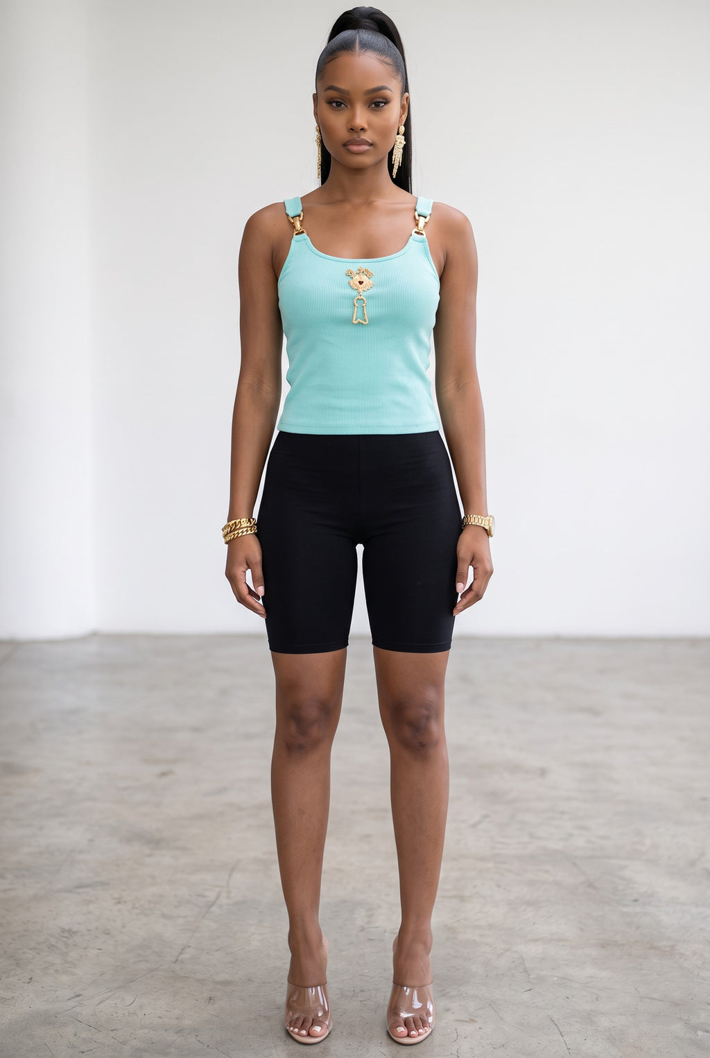 Hush Boutique mint green ribbed tank top with gold charm hardware and scoop neck worn by a model with black shorts
