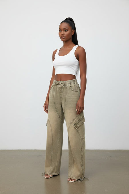 Hush Boutique overdyed vintage barrel fit cargo jeans in a faded olive green with elastic waist and drawstring.