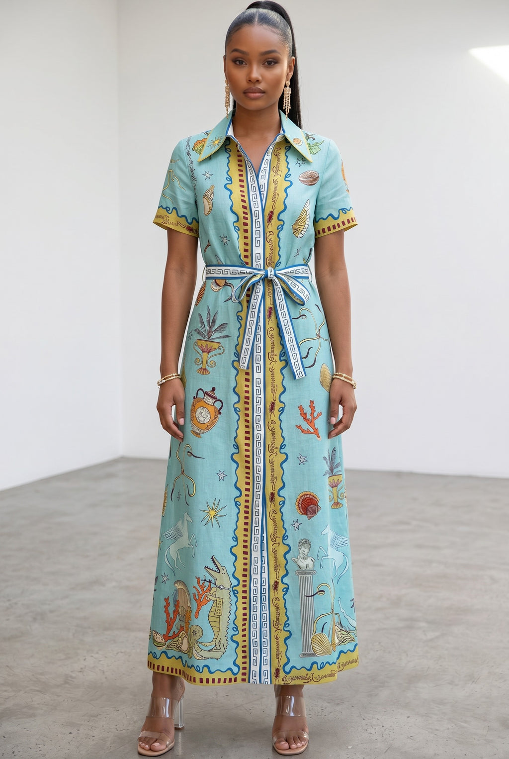 Hush Boutique The Passport Please light blue shirt dress with a graphic print, collar, and matching waist tie belt.