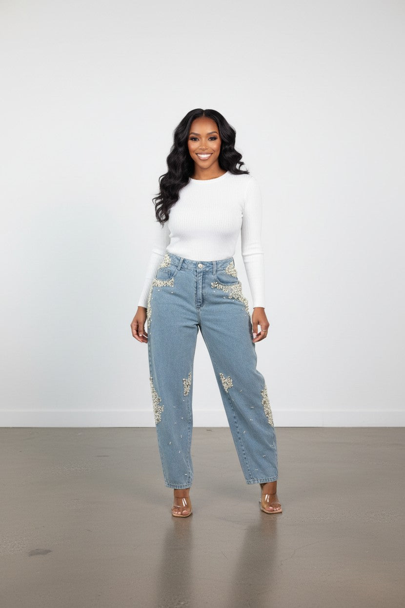 Hush Boutique light blue denim barrel jeans adorned with pearl and bead embellishments on hips and legs.