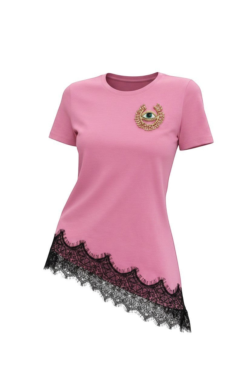 Hush Boutique pink cotton t-shirt with crew neck, short sleeves, eye motif, and black lace trim on asymmetrical hem.