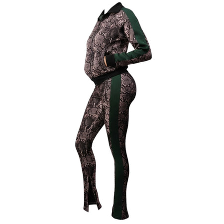Hush Boutique women's two-piece tracksuit with a snake print pattern, featuring green side stripes and a zip-up jacket.