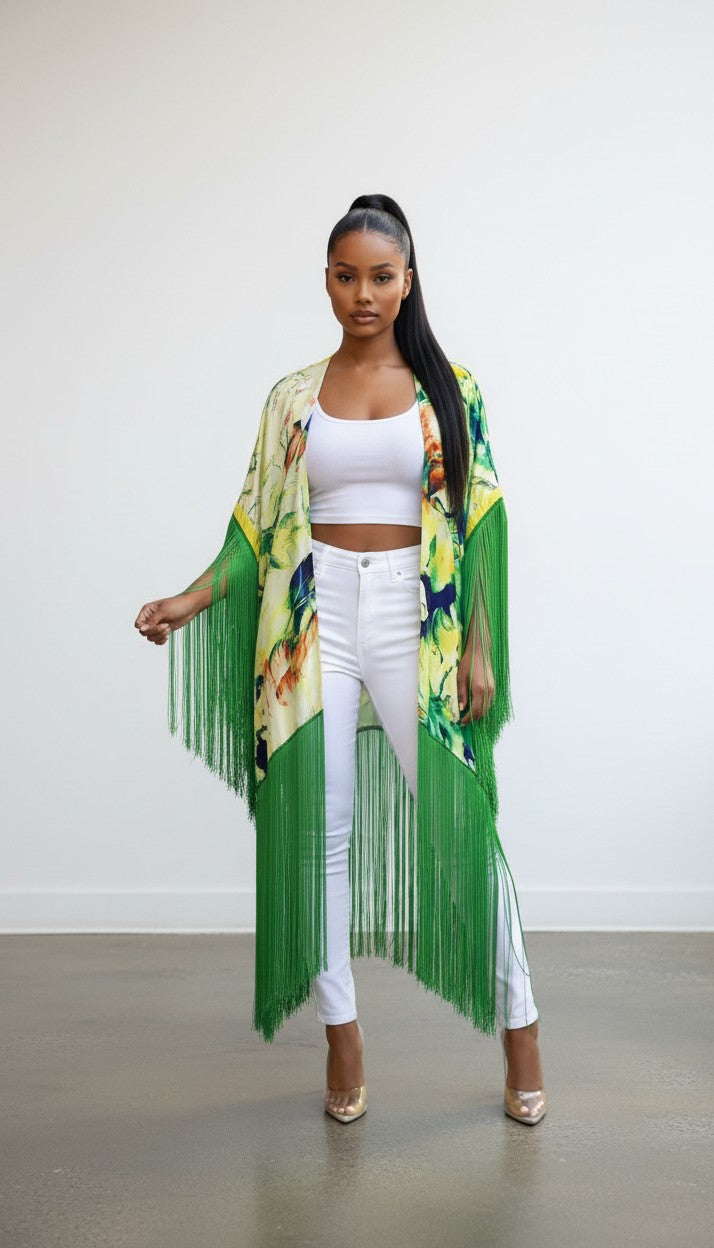 Hush Boutique tropical print open front kimono with long green fringe detail worn by a model in white outfit