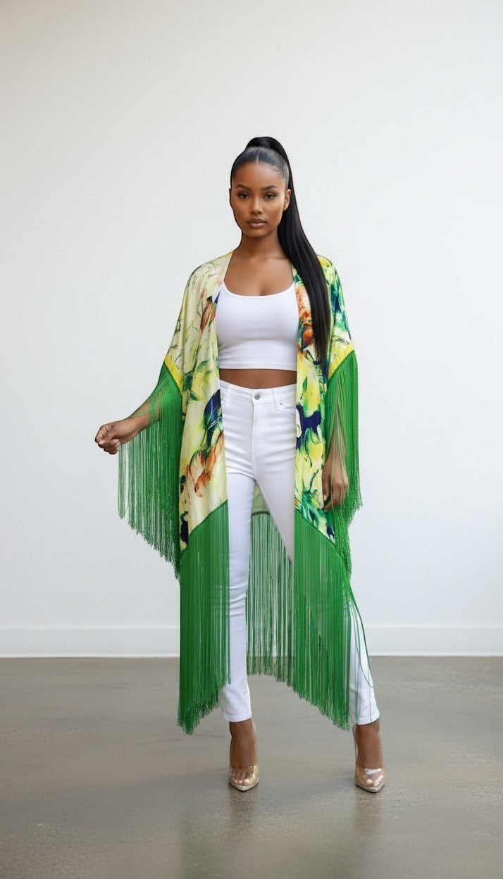Hush Boutique tropical print open front kimono with long green fringe detail worn by a model in white outfit