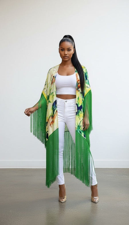 Hush Boutique tropical print open front kimono with long green fringe detail worn by a model in white outfit