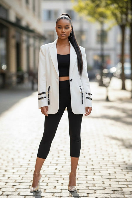 Hush Boutique white longline boyfriend blazer with notched collar, single button, waist pockets, and buckle detail. Polyester and rayon blend.