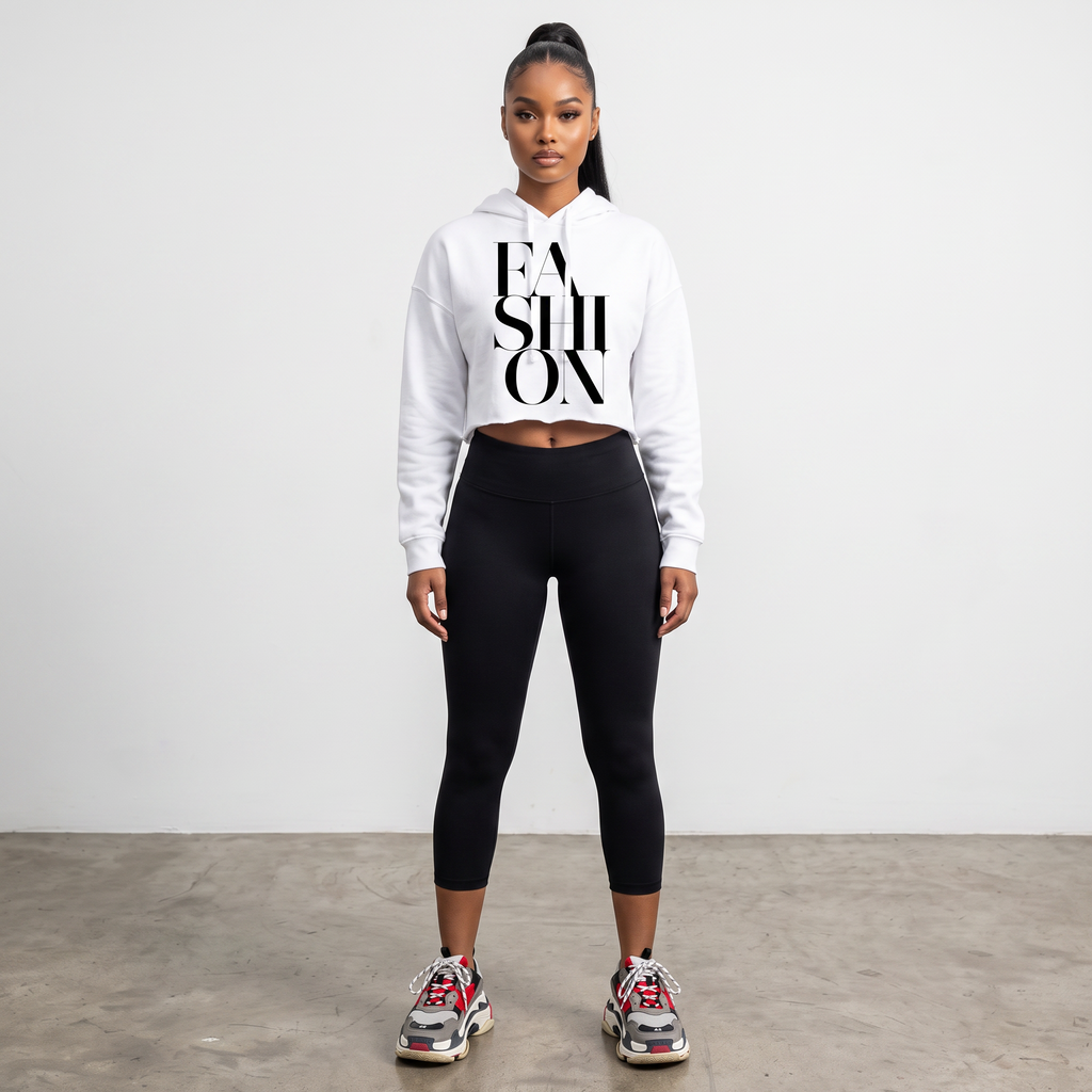 Hush Boutique white crop hoodie with FASHION graphic print worn by a model with black leggings and sneakers
